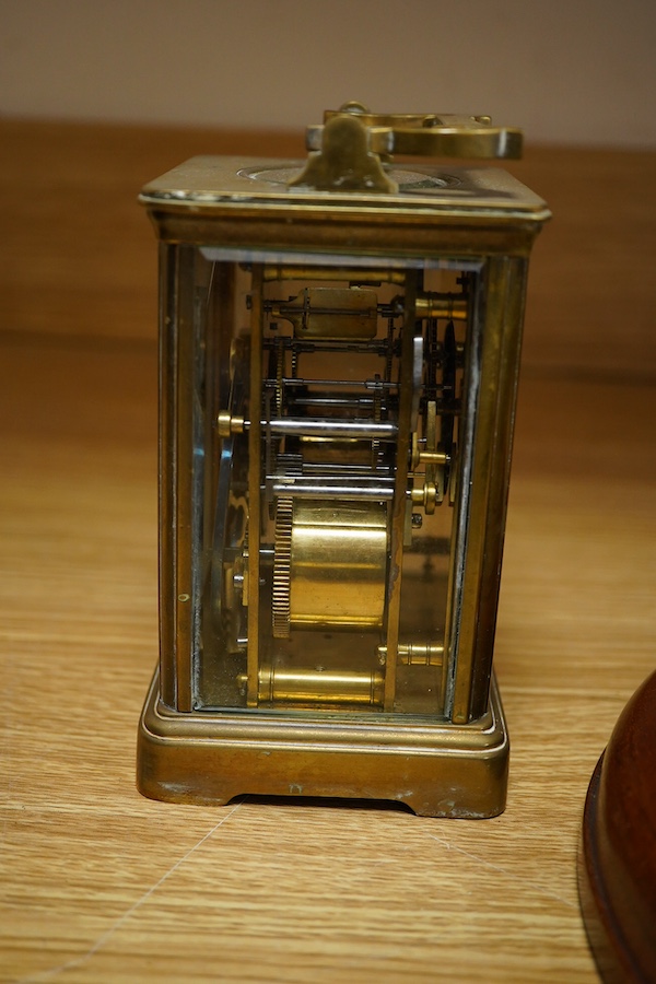A brass bulk head timepiece and a late 19th century brass cased carriage clock, the dial inscribed Mallory Bath, made in Paris, with key